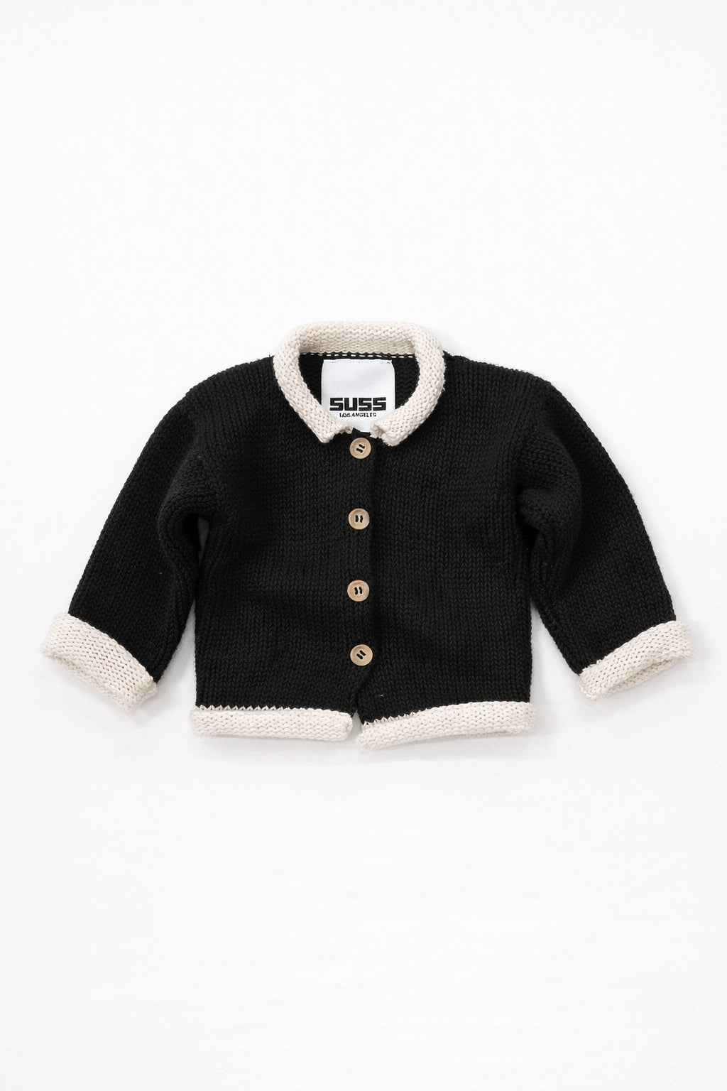 Black and cream cotton baby rollneck cardigan with wooden buttons front view