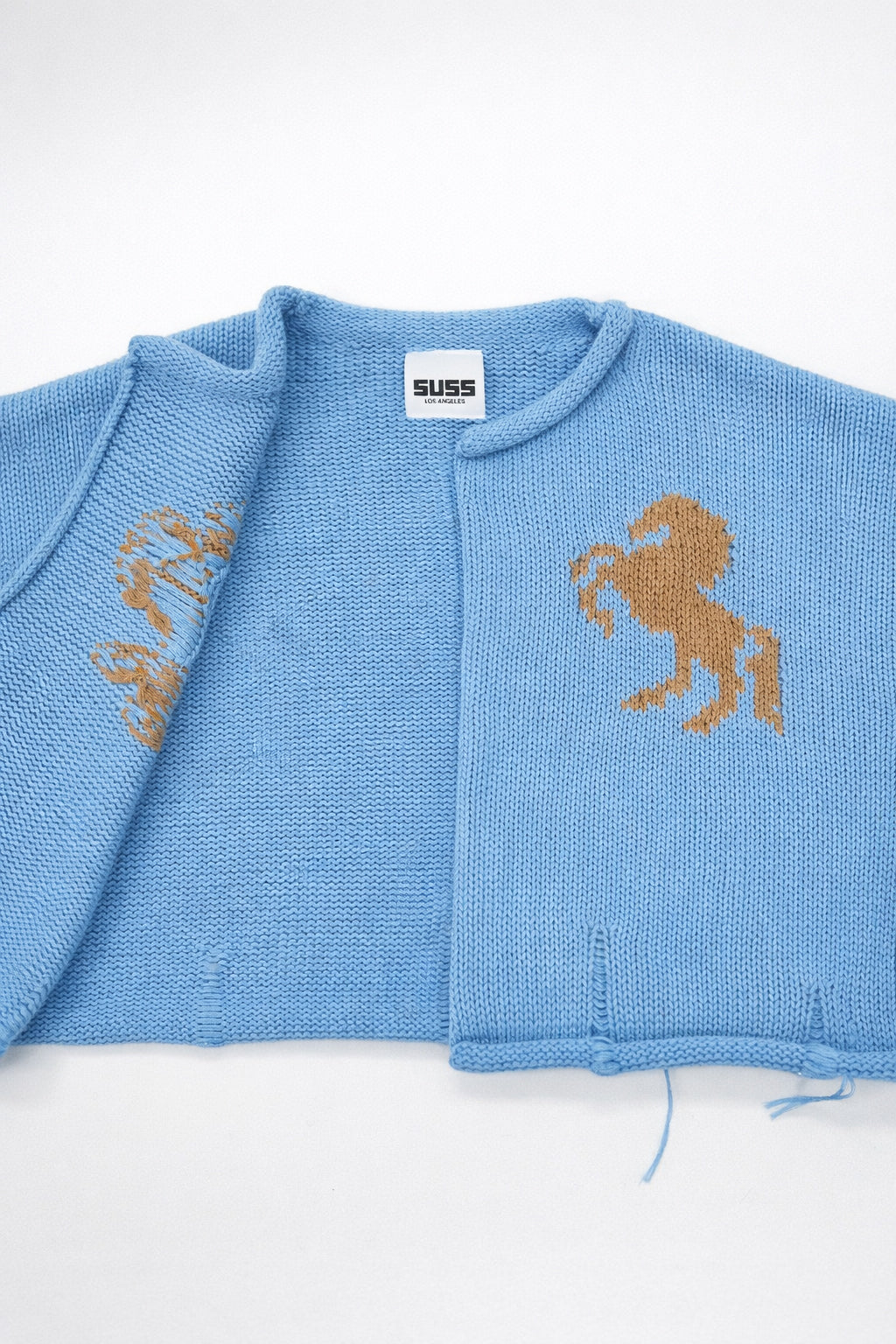 Interior knit detail of baby blue cotton cropped jacket by Suss Knits