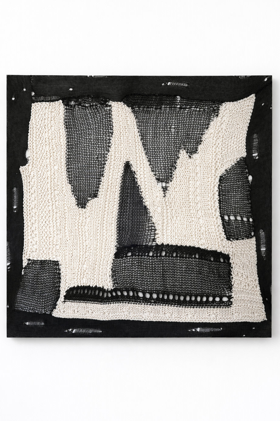 Large abstract textile wall art in black and cream, hand loomed knit and mesh composition with varied yarn textures and dimensional stitching, made in Los Angeles by Suss Knits
