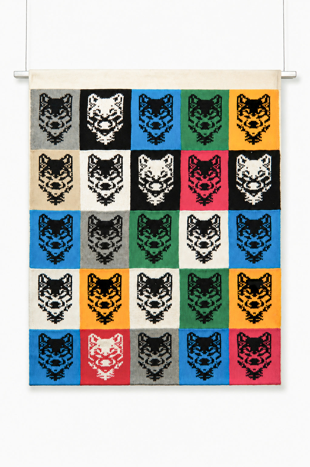 Hand-loomed wolf grid knit wall hanging made of cotton panels with steel hanging rod, 50 by 40 inches