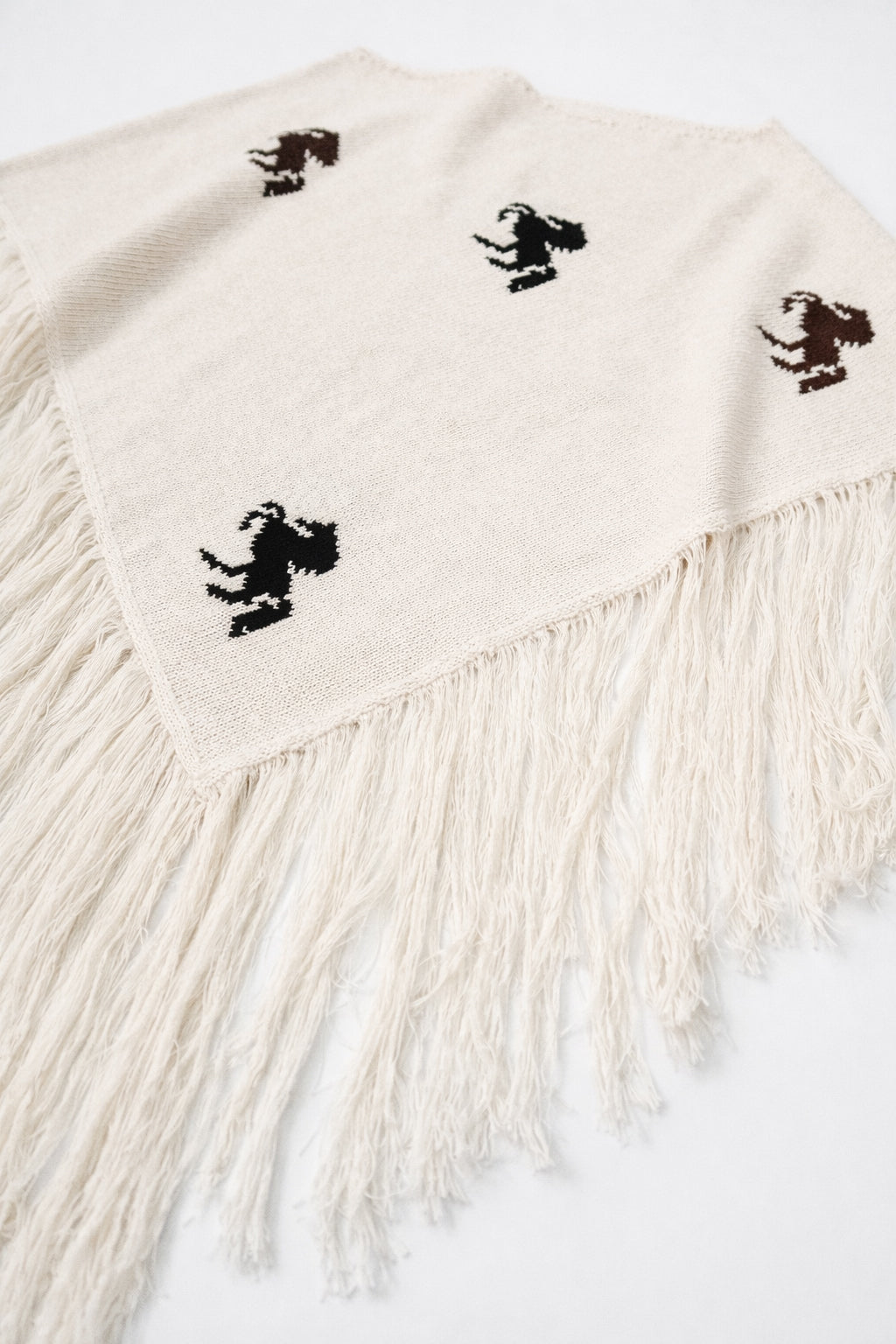 cream knit poncho fringe detail soft cotton texture