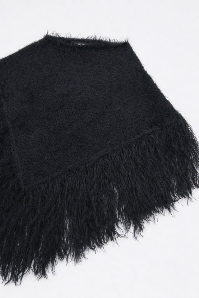 Black fuzzy cotton viscose knit poncho texture detail at angle shape