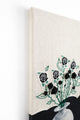 left top angled view of mixed media textile wall art combining knit, embroidery, and painting