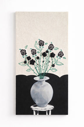 Suss Knits black rose textile wall art with hand loomed cotton knit panel, crocheted roses, and painted still life vase, 24x48 inches