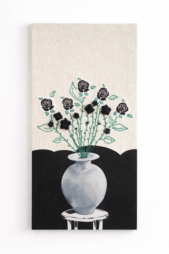 Suss Knits black rose textile wall art with hand loomed cotton knit panel, crocheted roses, and painted still life vase, 24x48 inches