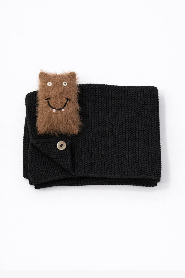 Black knit cotton baby blanket with handmade fuzzy monster toy in recycled cotton