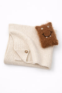 Cream baby knit cotton blanket with handmade fuzzy monster toy for infants