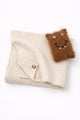 Cream baby knit cotton blanket with handmade fuzzy monster toy for infants