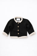 Black and cream cotton baby rollneck cardigan with wooden buttons front view