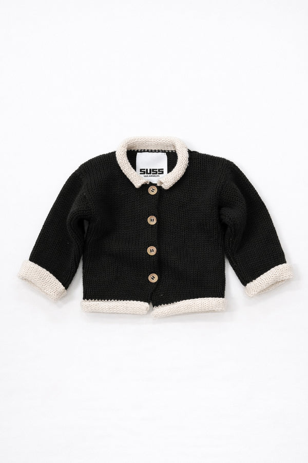 Black and cream cotton baby rollneck cardigan with wooden buttons front view