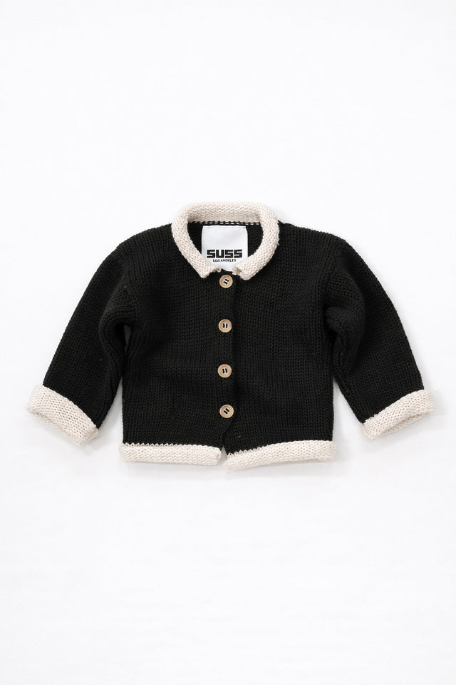 Black and cream cotton baby rollneck cardigan with wooden buttons front view
