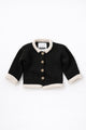 Black and cream cotton baby rollneck cardigan with wooden buttons front view