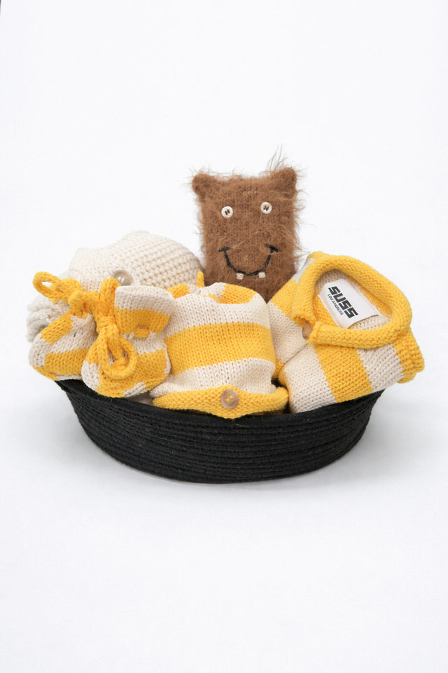 Yellow and cream cotton striped baby gift set in basket with cardigan, blanket, beanie, booties and toy