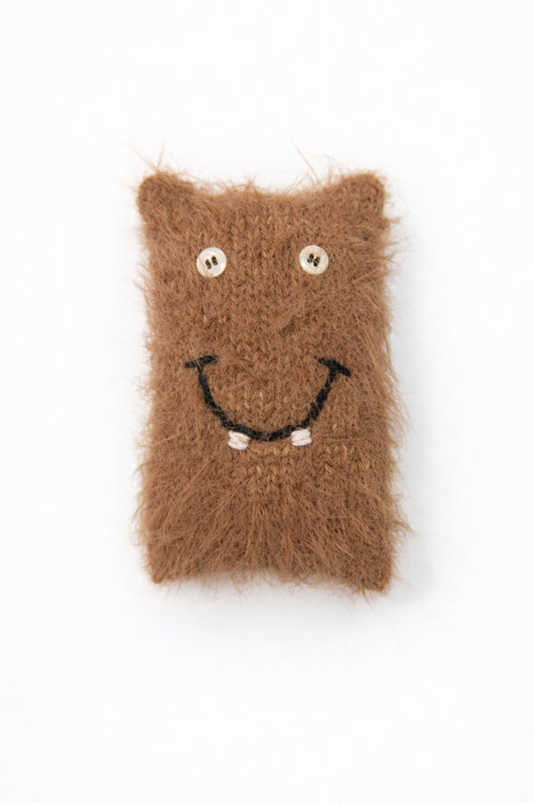 Handmade fand hand loomed cotton and viscose fuzzy monster baby toy with button eyes and smile
