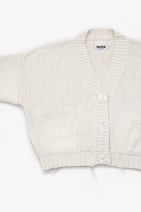 View of the armhole shape detail on the suss knits recycled cotton cream cardigan