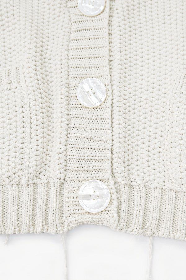 Close up of knit texture view of the Suss Knits cream cardigan knit in recycled cotton