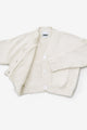 Textured Suss Knits cardigan hand loomed in cream recycled cotton with an open front view