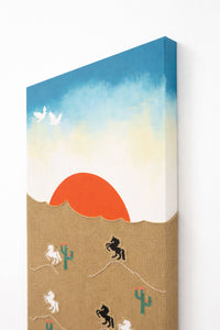 angled view of hand loomed textile wall art with desert sunset and embroidered horses