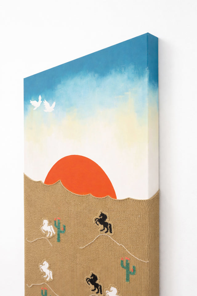 angled view of hand loomed textile wall art with desert sunset and embroidered horses