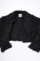 Detailed view of black fringe knit jacket showing contrast between structured knit and soft fringe