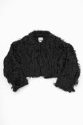Black hand loomed cropped jacket with long viscose fringe in a textured knit construction