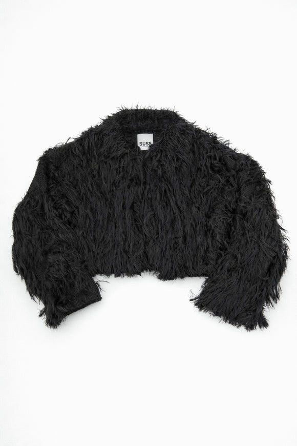 Black hand loomed cropped jacket with long viscose fringe in a textured knit construction