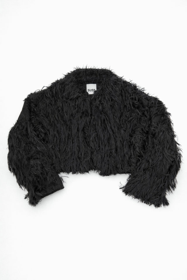 Black hand loomed cropped jacket with long viscose fringe in a textured knit construction