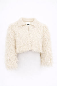 Cropped cream fringe jacket shown on form, featuring hand loomed cotton knit base with long shaggy fringe