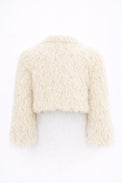 Back view of cream cropped fringe jacket with hand loomed knit base and layered viscose fringe texture