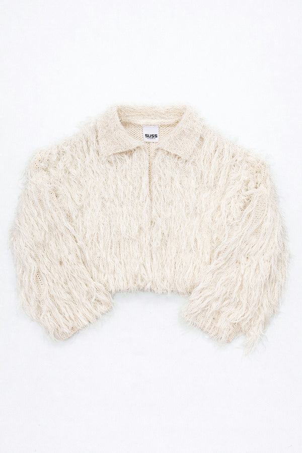 Cream hand loomed cropped cotton jacket with long viscose fringe knit in a textured knit construction