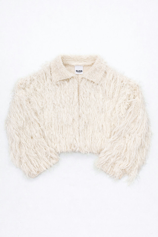 Cream hand loomed cropped cotton jacket with long viscose fringe knit in a textured knit construction