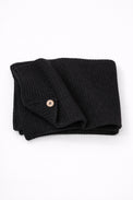 Hand loomed cotton black baby blanket with textured stitch and raw edge detail