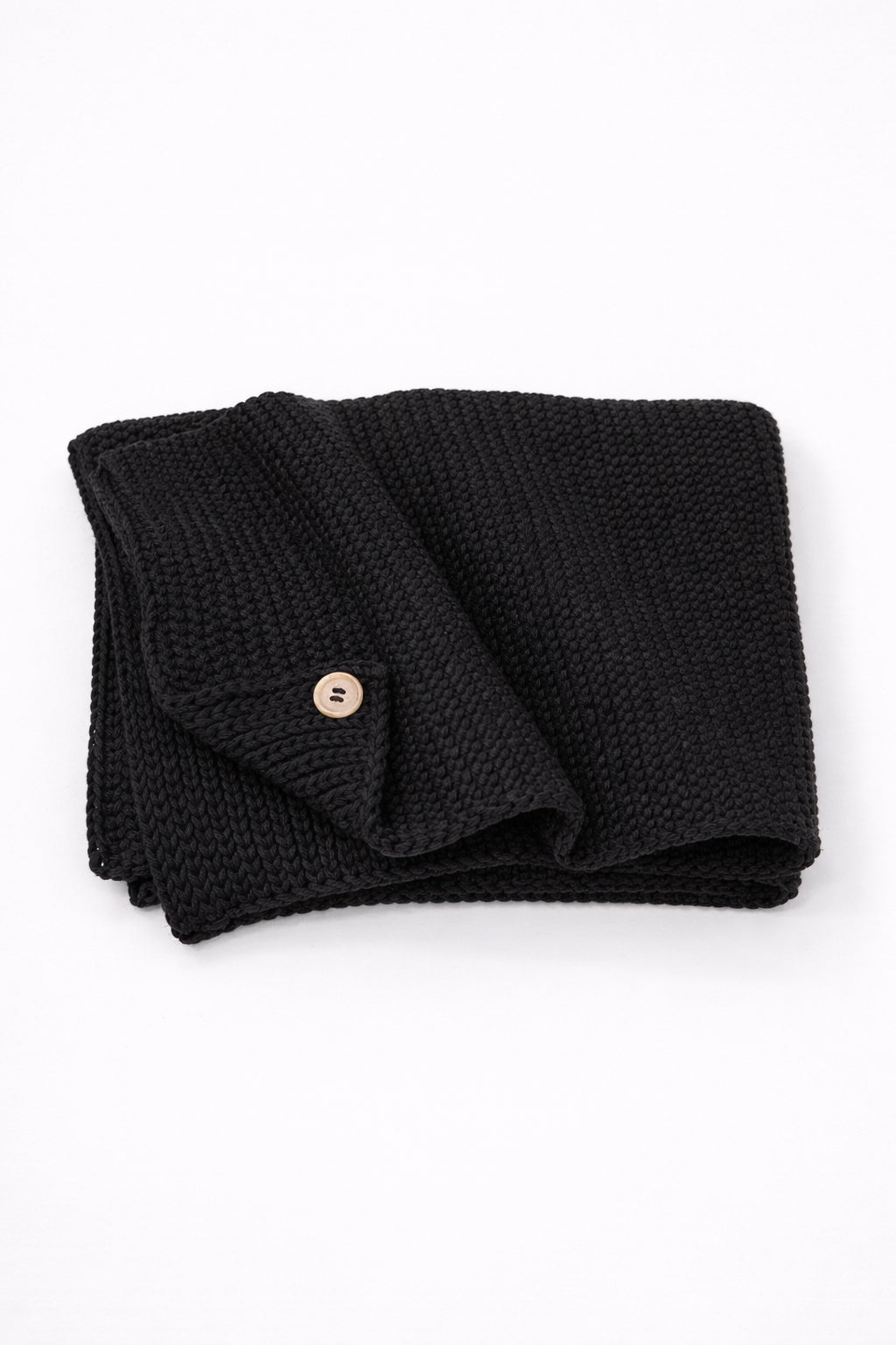 Hand loomed cotton black baby blanket with textured stitch and raw edge detail