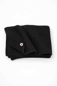 Hand loomed cotton black baby blanket with textured stitch and raw edge detail