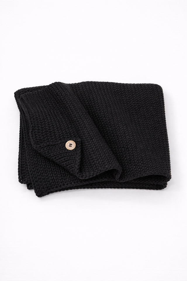 Hand loomed cotton black baby blanket with textured stitch and raw edge detail