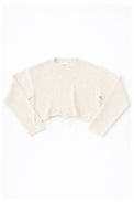 Cream cotton cropped knit sweater laid flat with soft texture and raw hem detail by Suss Knits