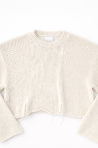 Detail front flat lay of cream cotton light weight knit crewneck sweater by Suss Knits