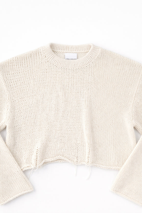Detail front flat lay of cream cotton light weight knit crewneck sweater by Suss Knits