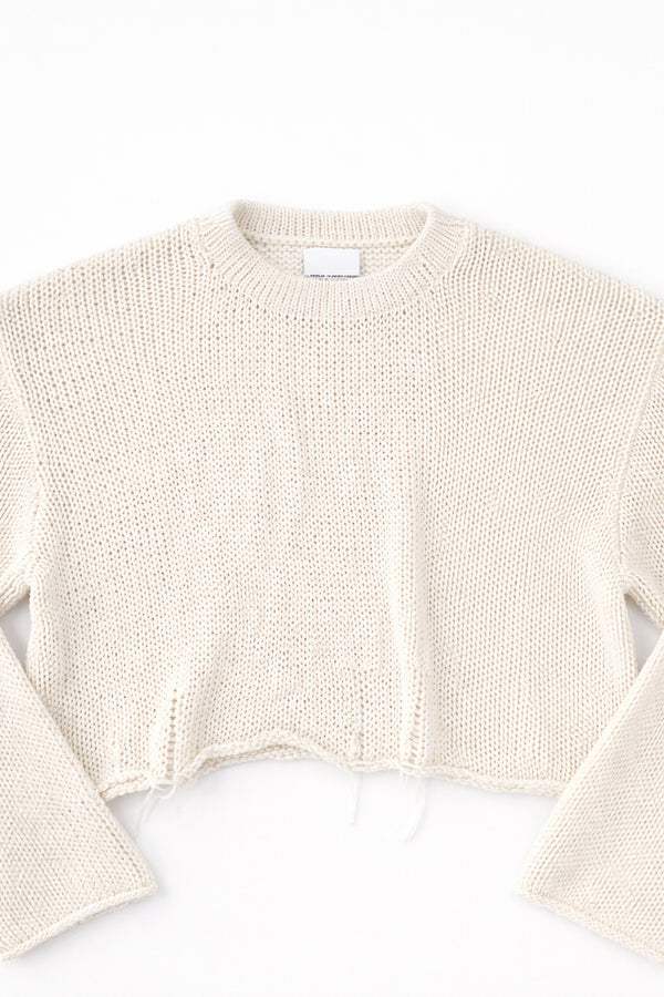 Detail front flat lay of cream cotton light weight knit crewneck sweater by Suss Knits