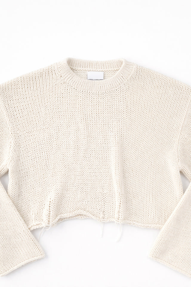 Detail front flat lay of cream cotton light weight knit crewneck sweater by Suss Knits