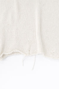 Raw edge hem detail of cream cotton light weight knit sweater by Suss Knits