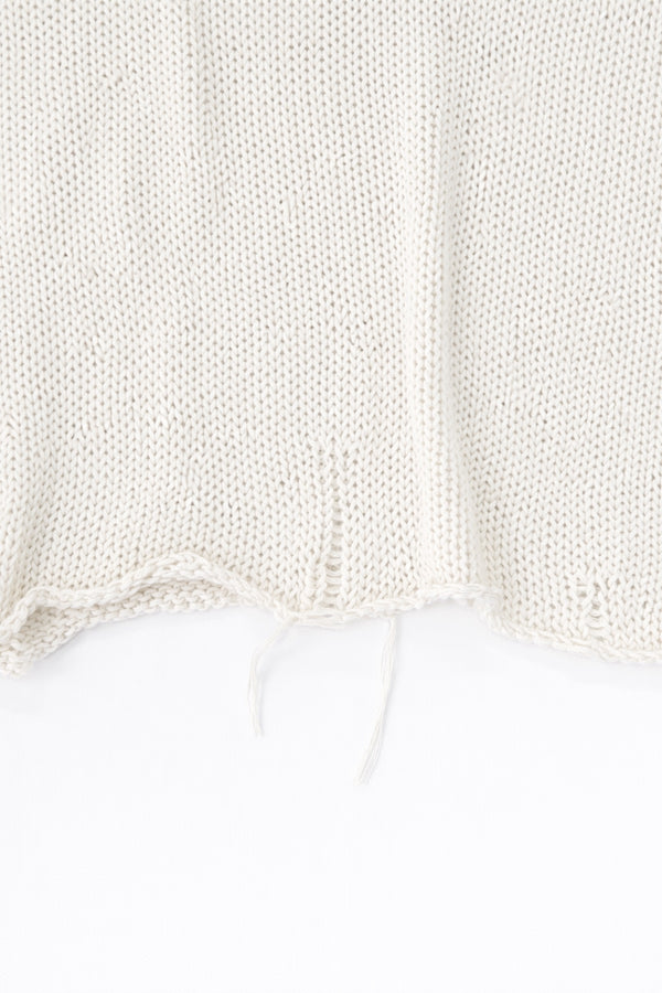 Raw edge hem detail of cream cotton light weight knit sweater by Suss Knits