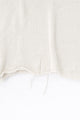 Raw edge hem detail of cream cotton light weight knit sweater by Suss Knits