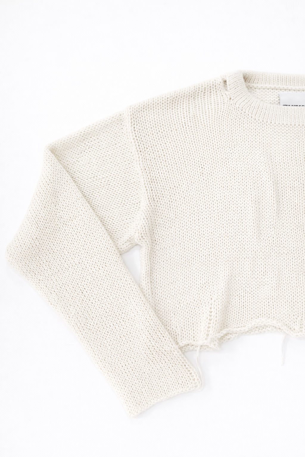 Sleeve texture detail of cream cotton light weight knit sweater by Suss Knits