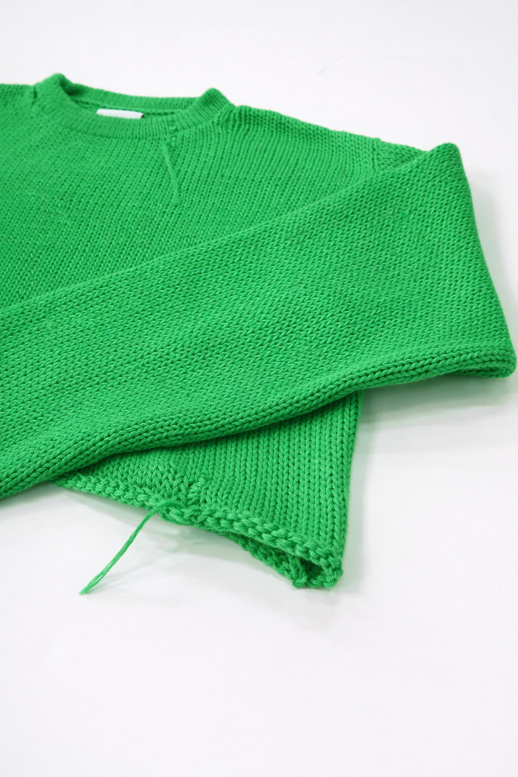 Angle view of the Suss knits hand loomed light weight sweater knit in los angeles