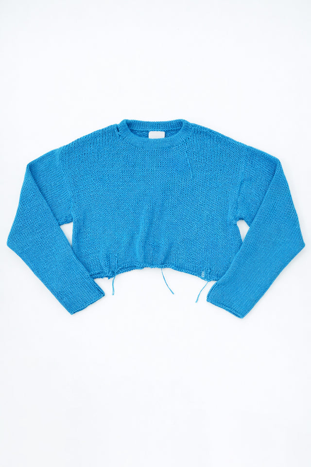 Soft cotton cropped crewneck sweater flat lay hand loomed in turquoise yarn in a light weight knit by Suss Knits