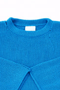 Neckline detail of cotton hand loomed lightweight turquoise sweater
