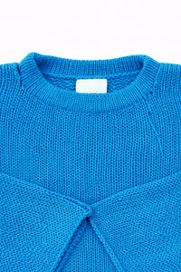Neckline detail of cotton hand loomed lightweight turquoise sweater