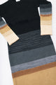 Close-up of Suss knit dress highlighting gray variegated knit texture and color transitions
