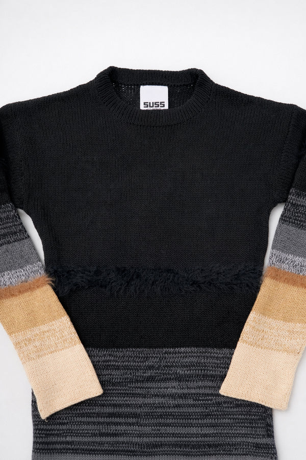 Close-up of Suss knit dress showing textured black and gray variegated knit pattern